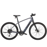Trek Dual Sport+ 2 e-hybrid bike with HyDrive pedal assist and versatile accessories, ready for city and trail riding.