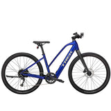 Trek Dual Sport+ 2 Stagger women's e-hybrid bike with Shimano Altus M2000 gears and HyDrive motor, ready for city and trail riding.