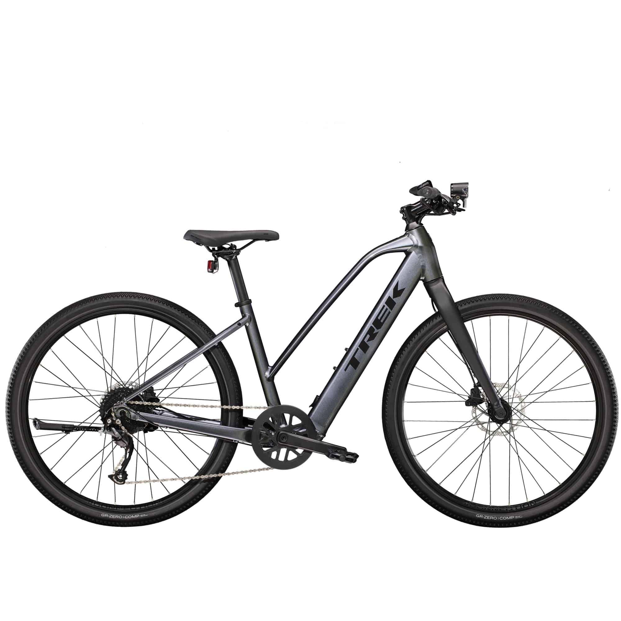 Trek Dual Sport+ 2 Stagger women’s e-hybrid bike with Shimano Altus M2000 gears and HyDrive motor, shown on a trail.