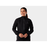 Trek Circuit Women's waterproof rain cycling jacket, lightweight and packable, shown in outdoor setting with reflective details.
