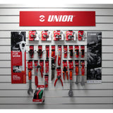 Unior retail pack with professional bike repair tools in red, displayed on point of sale workshop display.