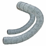 Supacaz Super Sticky Kush gravel handlebar tape with shock absorption and durability, wrapped around a bike handlebar.