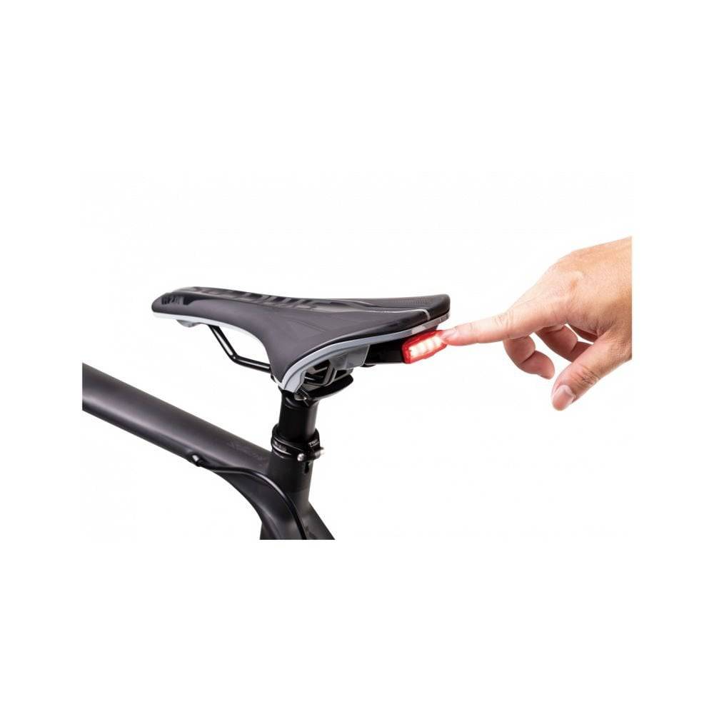 Topeak Redlite 30 black USB rechargeable rear bike light with 30 lumens, waterproof IPX6, mounted on a bicycle.