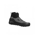 Fizik Terra Ergolace GTX waterproof flat MTB shoes with Vibram outsole, showing black shoes with textured sole and waterproof upper.