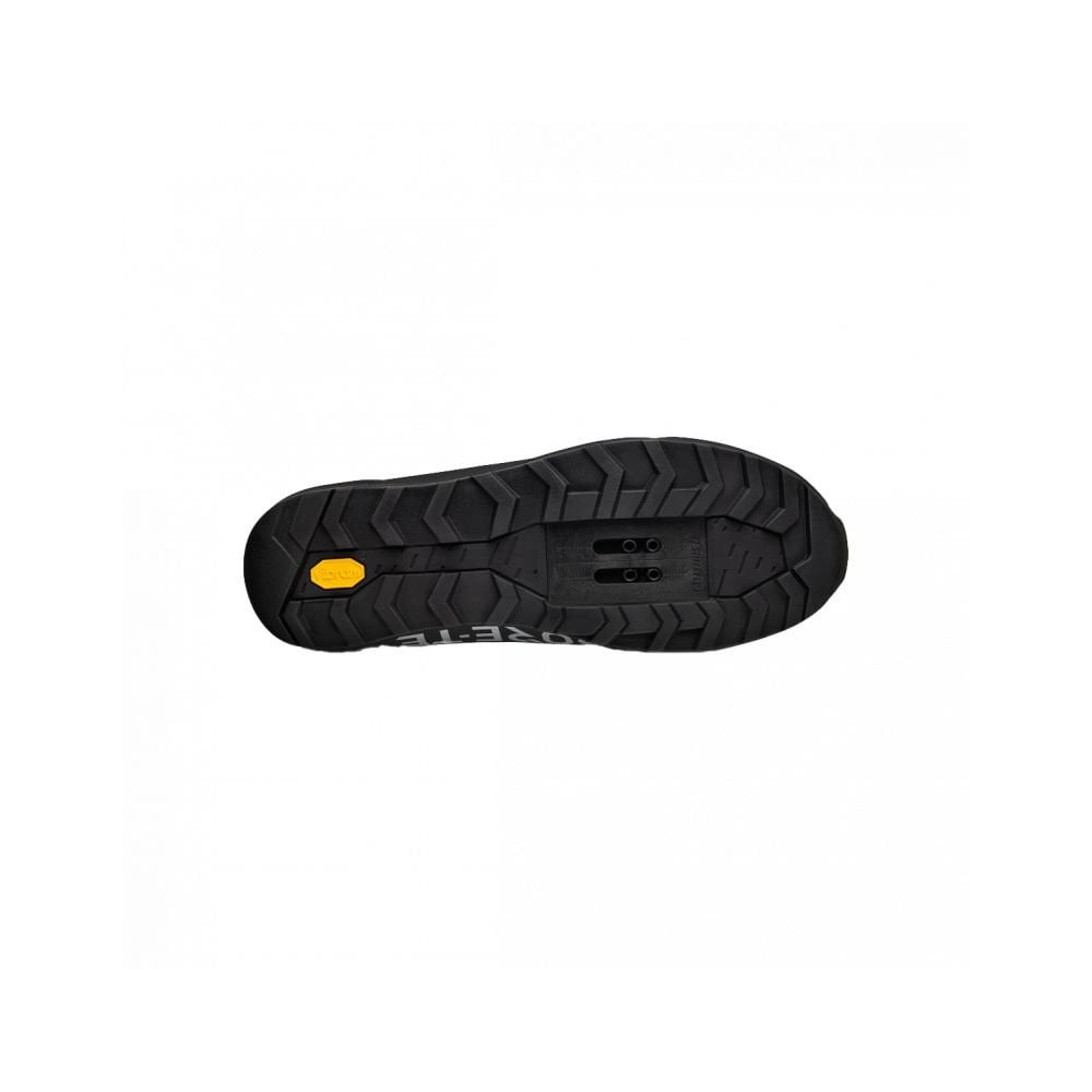 Fizik Terra Ergolace GTX waterproof flat MTB shoes with Vibram outsole, showing black waterproof cycling shoes with textured soles.