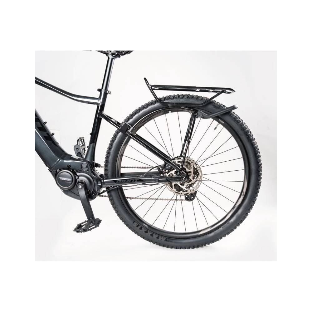Topeak Tetrarack M2 HD black rear bike rack with QuickTrack™ system, shown mounted on a bicycle for carrying gear.