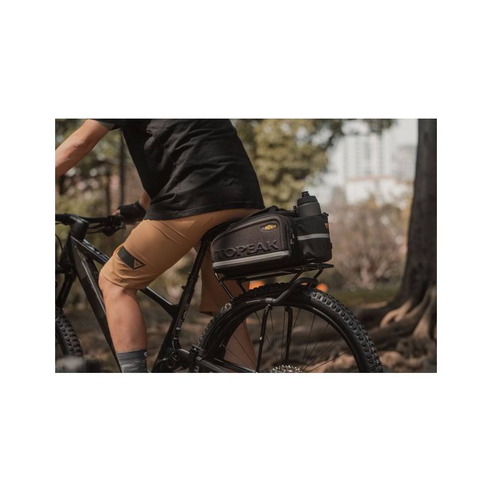 Topeak Tetrarack M2 HD black rear bike rack with QuickTrack system on a bicycle for carrying gear and accessories.