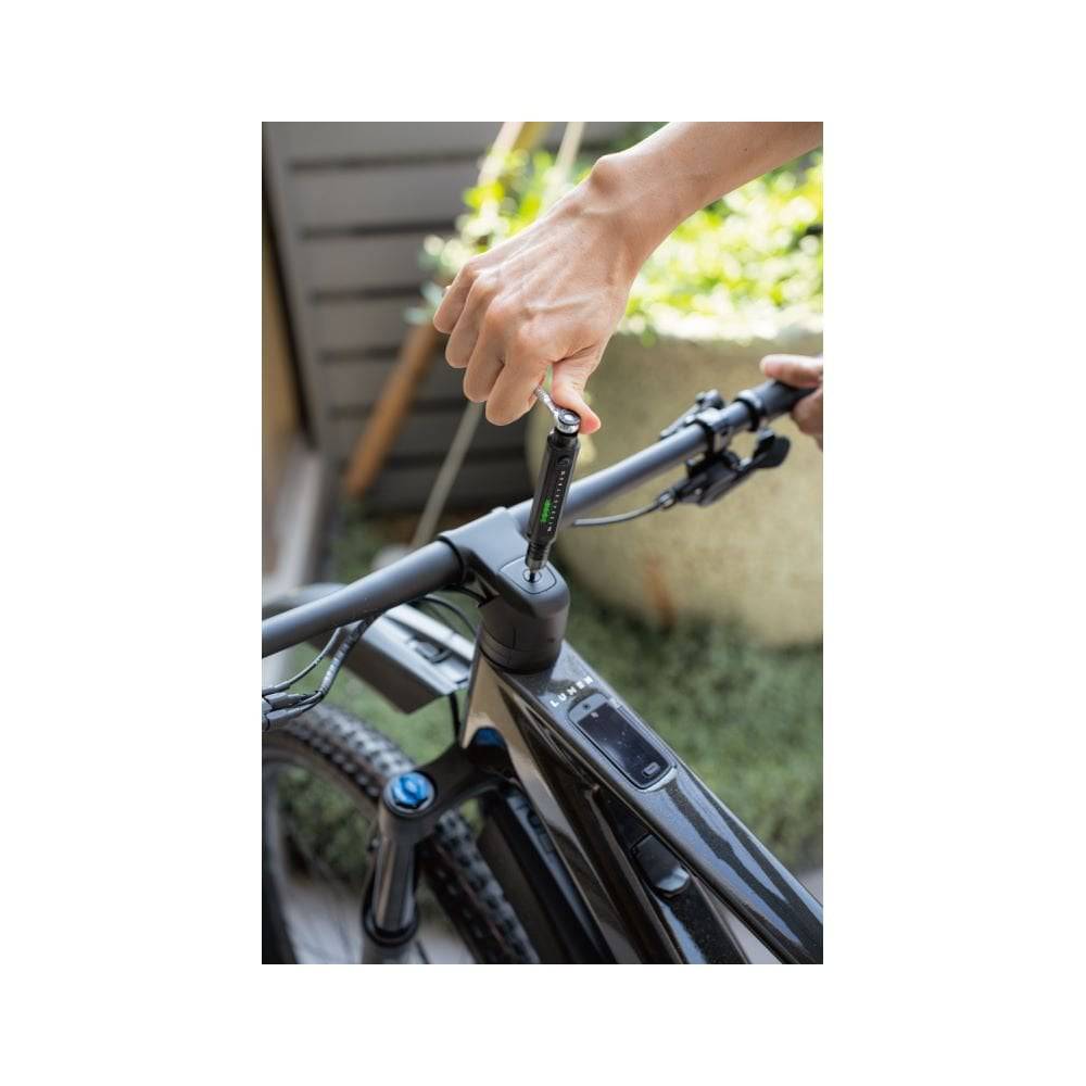 Topeak E-Torqbar digital torque wrench in black with LED indicator, used for precise torque measurements in workshop tools.