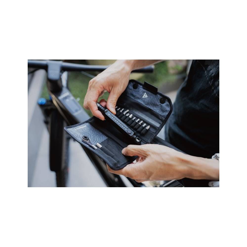 Topeak E-Torqbar digital torque wrench with LED indicator in black, showing measurement scale and ergonomic handle.
