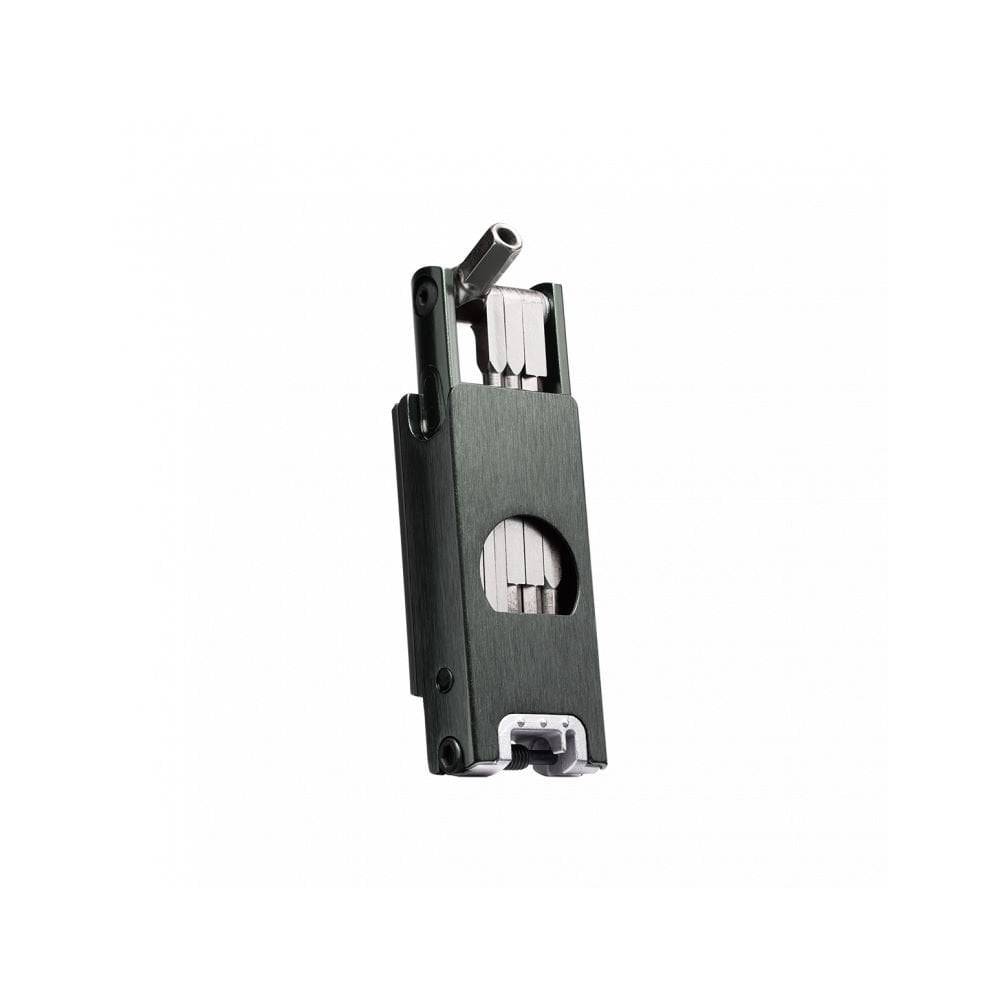 Crankbrothers F16 black multi-tool with 16 functions for tubeless bike repair, shown on a workshop workbench.