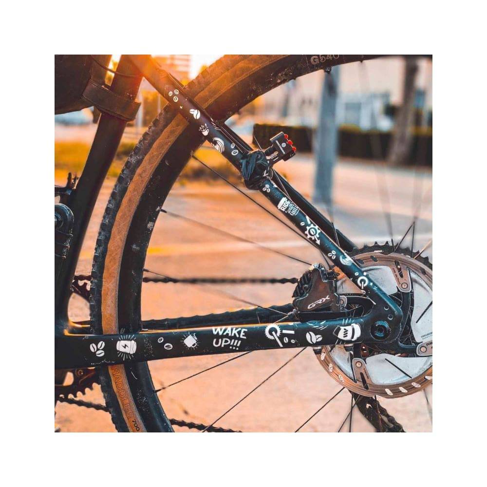 All Mountain Style frame guard stickers for gravel and road bikes, featuring colorful protective accessories on a bike frame.