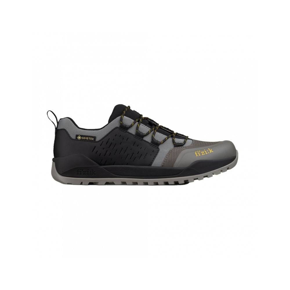 Fizik Terra Ergolace GTX waterproof flat MTB shoes with Vibram outsole, showing the durable hiking-style design and waterproof material.