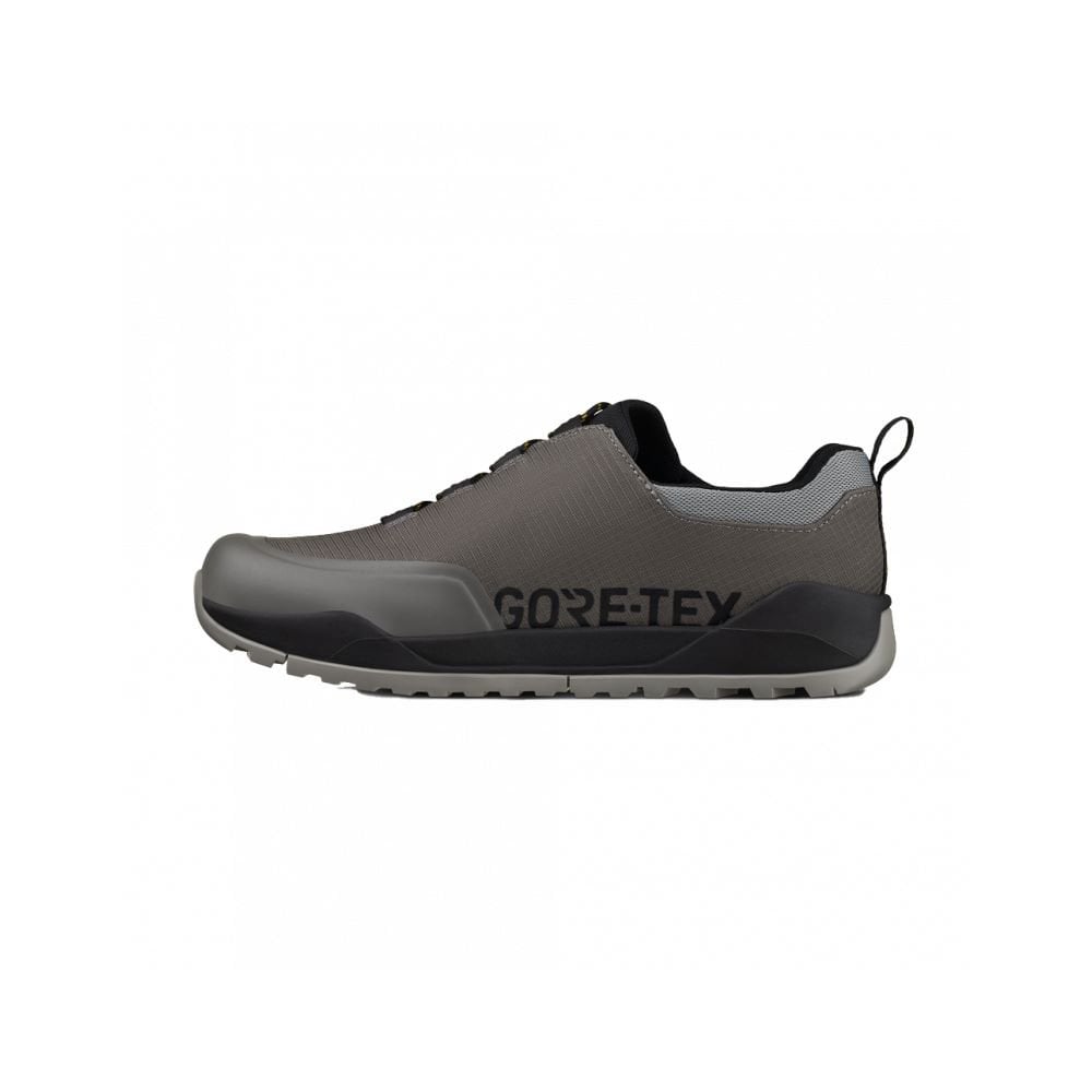 Fizik Terra Ergolace GTX waterproof flat MTB shoes with Vibram outsole, showing the black cycling shoes with textured tread.