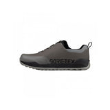 Fizik Terra Ergolace GTX waterproof flat MTB shoes with Vibram outsole, showing the black cycling shoes with textured tread.