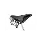 Brooks B67 coil spring saddle with chrome rails, designed for micro-adjust seat posts, showing a classic leather bicycle saddle.