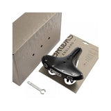 Brooks B72 unisex bicycle saddle with loop suspension for comfortable upright riding, shown with leather cover and metal rails.