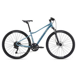 Liv Rove 2 2024 women's hybrid bike with Shimano drivetrain and disc brakes, featuring a sleek frame and comfortable riding position.