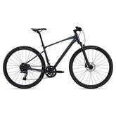 Giant Roam Disc 1 hybrid bike 2024 with Shimano CUES U6000 drivetrain and disc brakes, black and silver frame, ready for urban riding