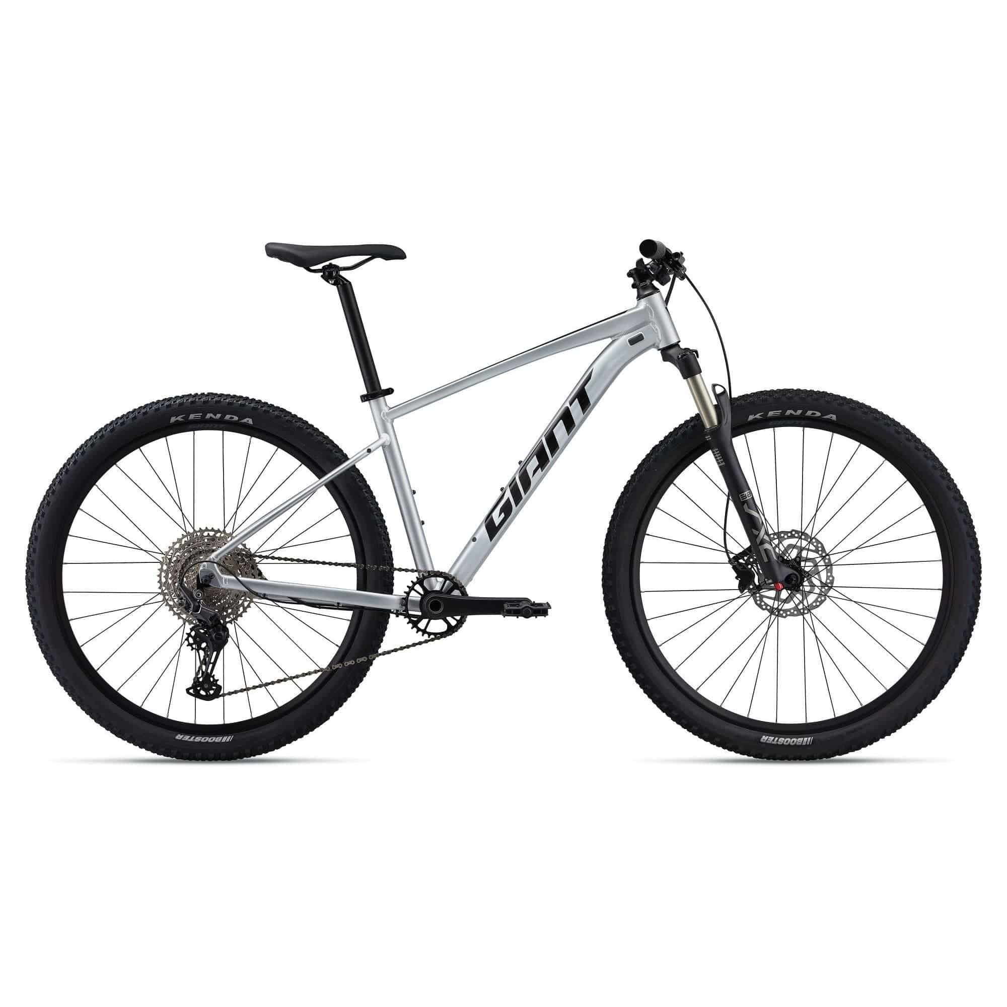 Giant Talon 0 2024 mountain bike with Shimano Deore M6100 disc brakes and XL frame, shown from side view.