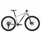 Giant Talon 0 2024 mountain bike with Shimano Deore M6100 disc brakes and XL frame, shown from side view.
