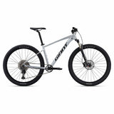 Giant Talon 0 2024 mountain bike with Shimano Deore M6100 disc brakes and XL frame, shown from side view.