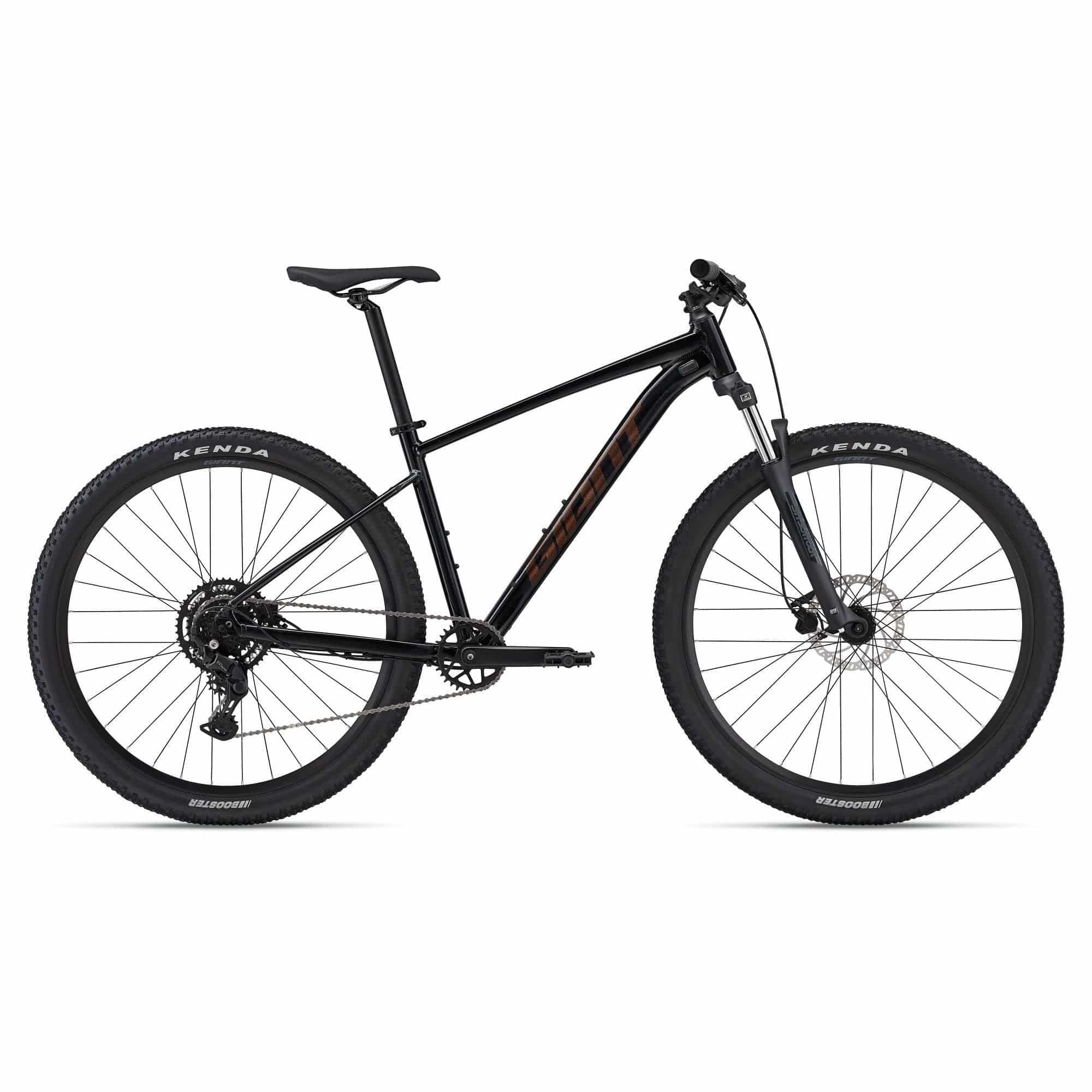 Giant Talon 2 2024 mountain bike with Shimano CUES U4000 drivetrain and disc brakes, featuring a rugged frame and knobby tires.