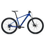 Giant Talon 3 2024 mountain bike with Shimano Acera gears, disc brakes, and a medium frame, ready for off-road riding.