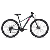 Liv Tempt 4 Women's 2024 mountain bike with Shimano Tourney drivetrain and disc brakes, shown with black frame and knobby tires.