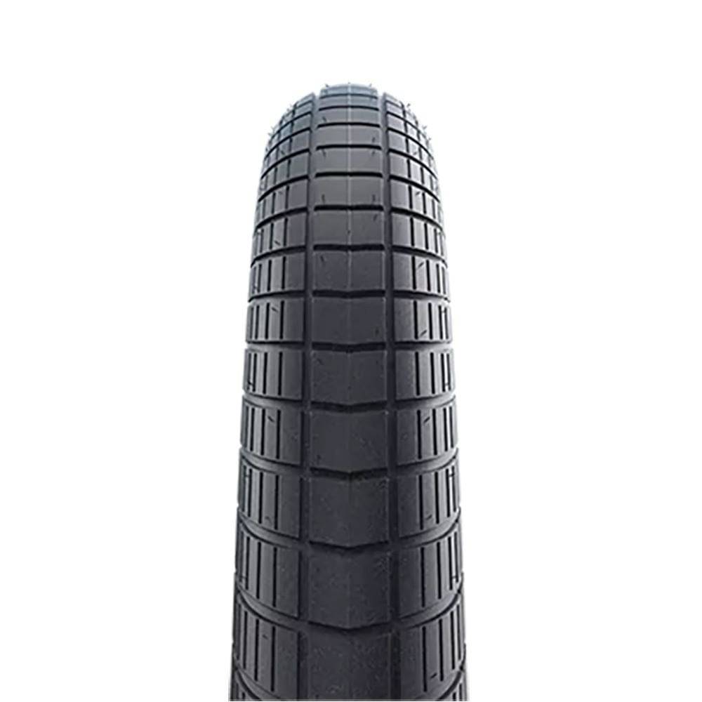 Schwalbe Big Apple K-Guard puncture-resistant balloon bike tire with reflective sidewalls for urban cycling.