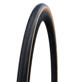 Schwalbe Lugano II road tyre with K-Guard puncture protection and silica compound, shown mounted on a bicycle wheel.