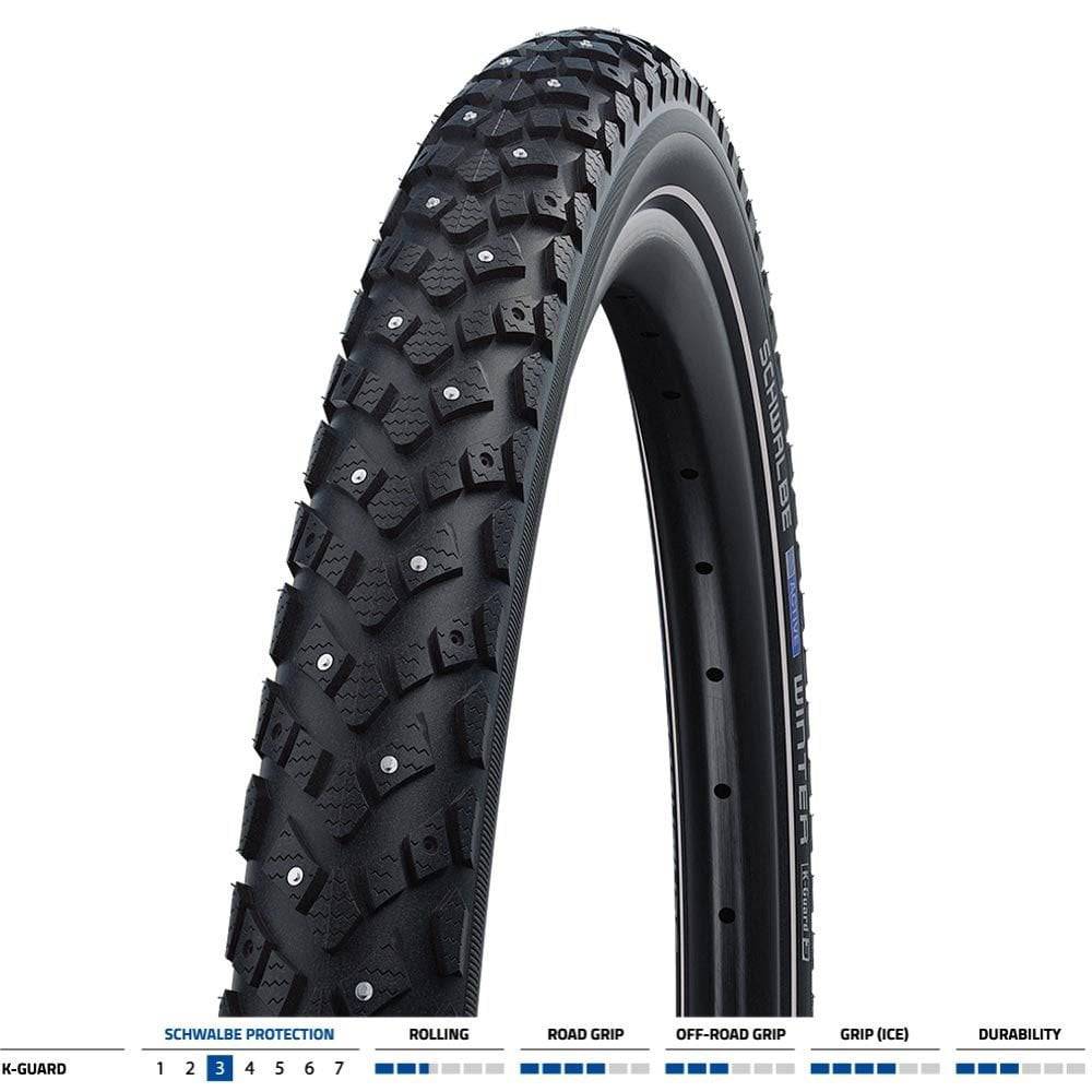 Schwalbe Winter K-Guard bicycle tyre with spikes and double defence puncture protection, showing tread pattern and spikes.