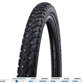 Schwalbe Winter K-Guard bicycle tyre with spikes and double defence puncture protection, showing tread pattern and spikes.