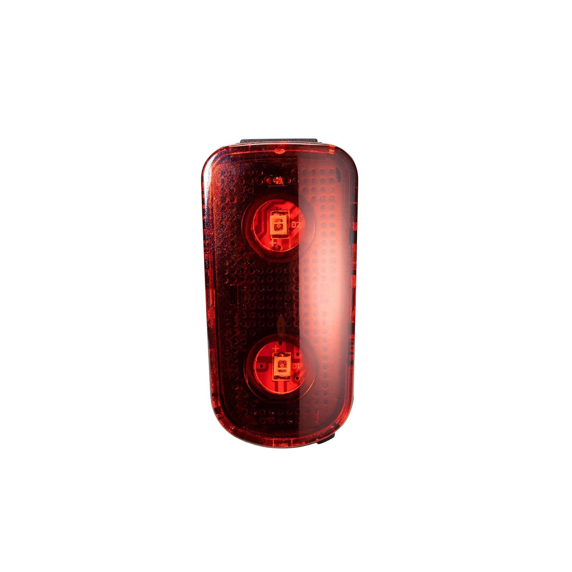 Giant Numen Alumbra TL rear helmet light with quick lock, low-power indicator, mounted on a bicycle helmet for visibility.