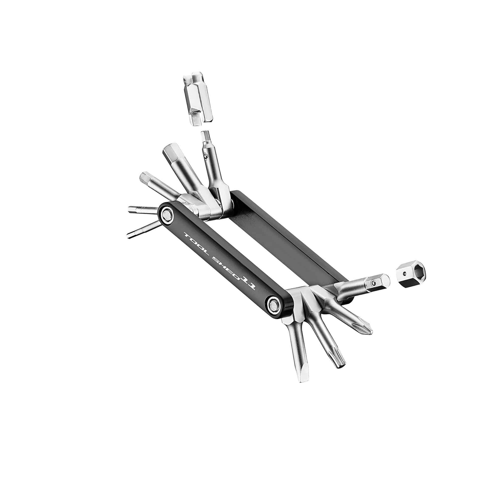Giant Workshop Giant Tool Shed 11 multi-tool with valve core and hex wrenches for bike repairs, laid out on a workbench.