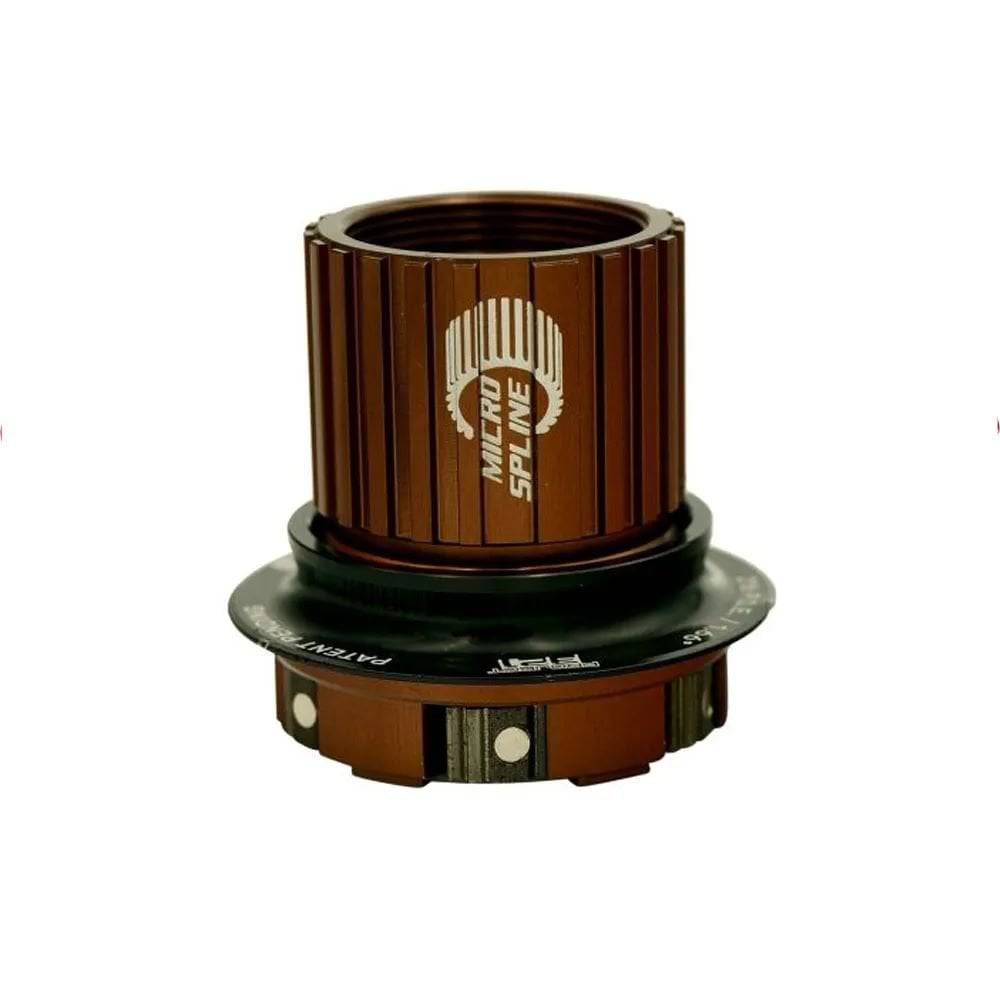 Stans NoTubes M-Pulse freehub kit for Shimano Micro Spline hubs, showing the black freehub body with branding and spline details.