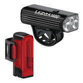 Lezyne Macro Drive 1400+ and Strip Drive Pro 400+ bike lights with USB-C recharge ports, mounted on a bicycle handlebars.