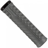 Lizard Skins Charger Evo bike grips with single-clamp lock-on design for MTB and BMX bikes, shown on a bicycle handlebar.