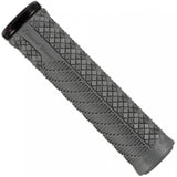 Lizard Skins Charger Evo bike grips with single-clamp lock-on design for MTB and BMX bikes, shown on a bicycle handlebar.