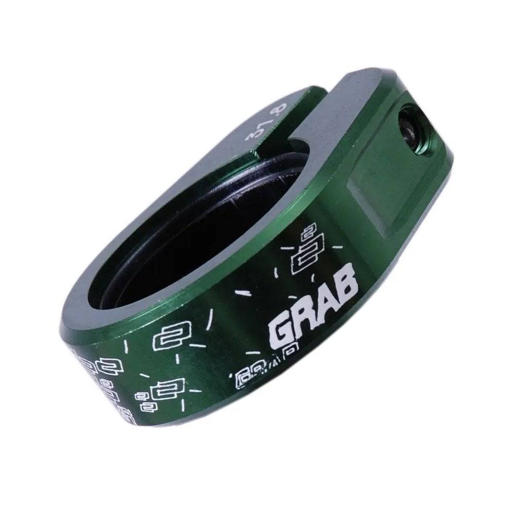 DMR Bikes single bolt seat clamp for bike seatpost, spare component, durable metal bike seat clamp, close-up of clamp hardware.