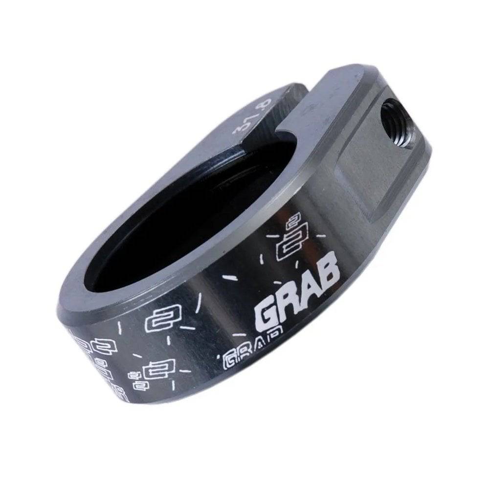 DMR Bikes single bolt grab seat clamp for bike seatpost, durable component spare part with metal finish and secure fastening.