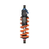 Fox DHX Factory 2-position adjustable rear shock damper for coil suspension, shown in a close-up view of the component.