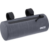 EVOC waterproof handlebar pack for bikes, 1.5L compact cycling pannier bag shown attached to a bicycle handlebar.