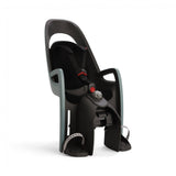 Hamax Caress child bike seat with carrier adapter, rear-mounted safety seat designed for secure and comfortable child cycling.