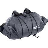 EVOC waterproof handlebar pack with Boa closure, 9L cycling storage bag mounted on a bike handlebar for outdoor adventures.