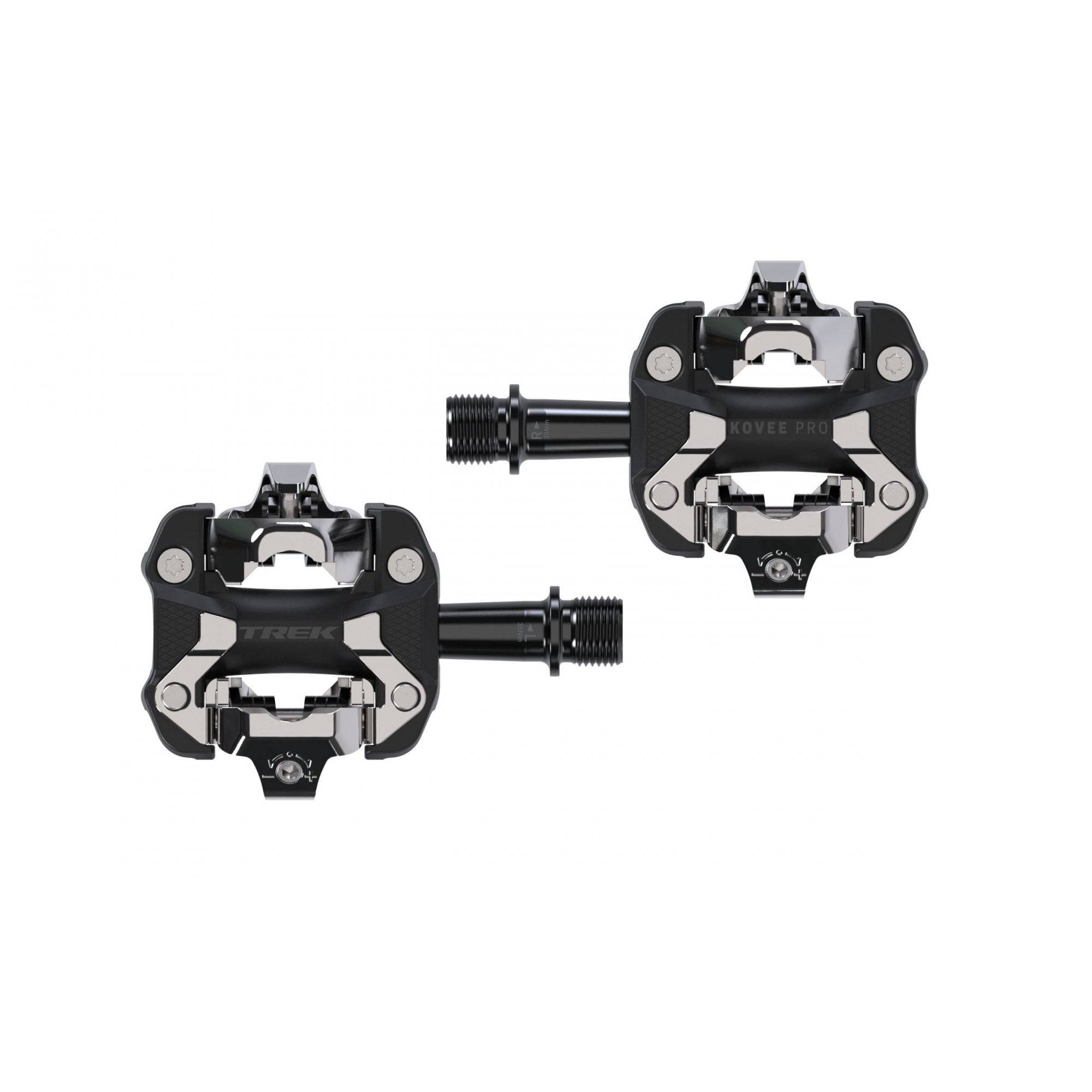 Trek Kovee Pro black clipless pedal set with 9/16" spindle for road and mountain biking, shown from a side angle.