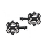 Trek Kovee Pro black clipless pedal set with 9/16" spindle for road and mountain biking, shown from a side angle.