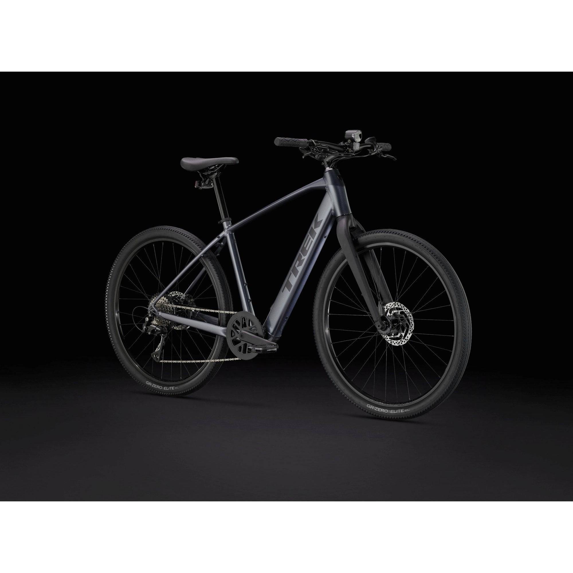 Trek Dual Sport+ 2 LT 2025 electric hybrid bike with sturdy frame, digital display, and fat tires for urban and trail riding.