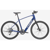 Trek Dual Sport+ 2 LT 2025 electric hybrid bike with black frame, suitable for urban and trail riding, displayed outdoors.