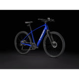 Trek Dual Sport+ 2 LT 2025 electric hybrid bike with sleek frame, front suspension, and rugged tires for urban and trail riding.
