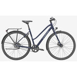 Trek District 3 Midstep hybrid bike for women, urban commuter bike with comfortable frame and versatile design, front and rear gears.